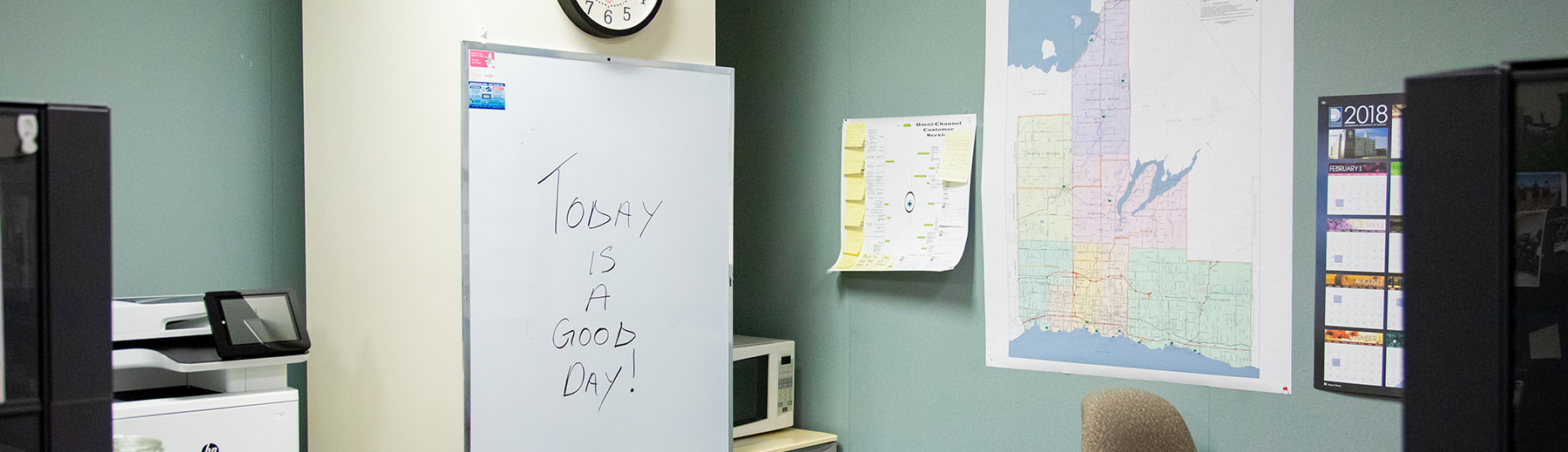 A whiteboard in an office with "Today is a good day!" written on it