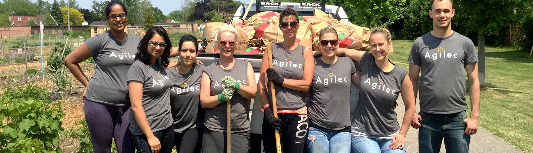 Staff from Agilec volunteer at a community clean-up