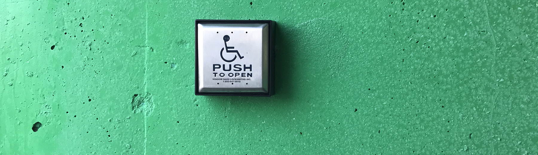 An accessible door button